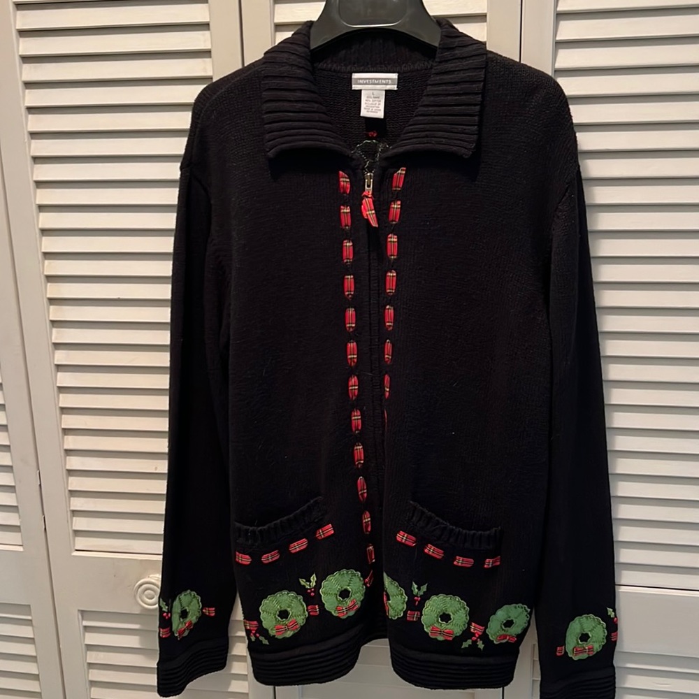 Christmas Sweater Black with Christmas wreath border on bottom and on sleeves.